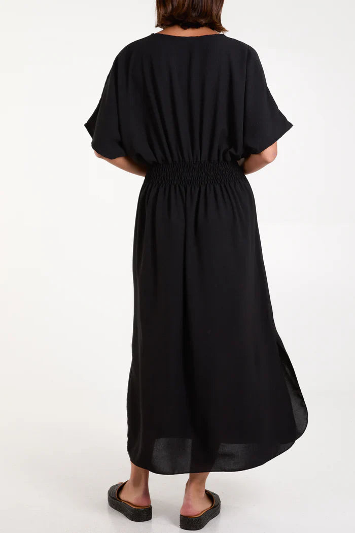 V Neck Shirred Waist Dress in black, back view.