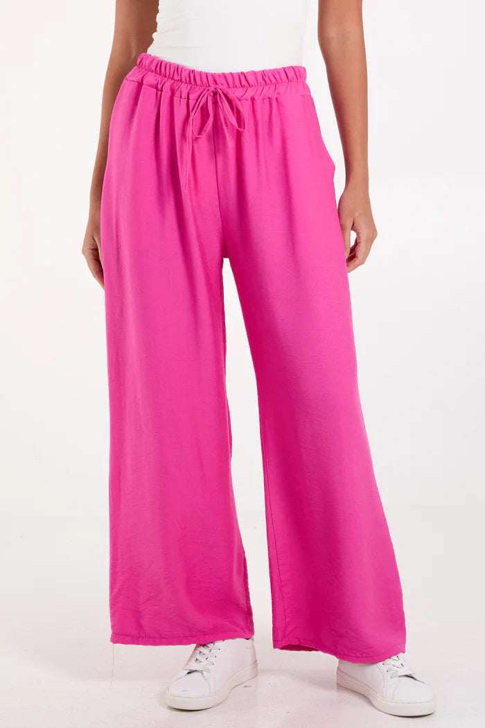 Wide leg crepe trousers in bright pink, 100% viscose.