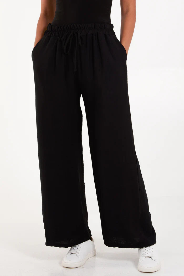 Wide leg crepe trousers made from 100% viscose.