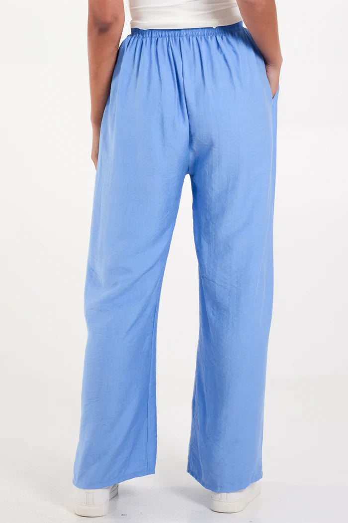 Wide leg crepe trousers in blue, made from 100% viscose.