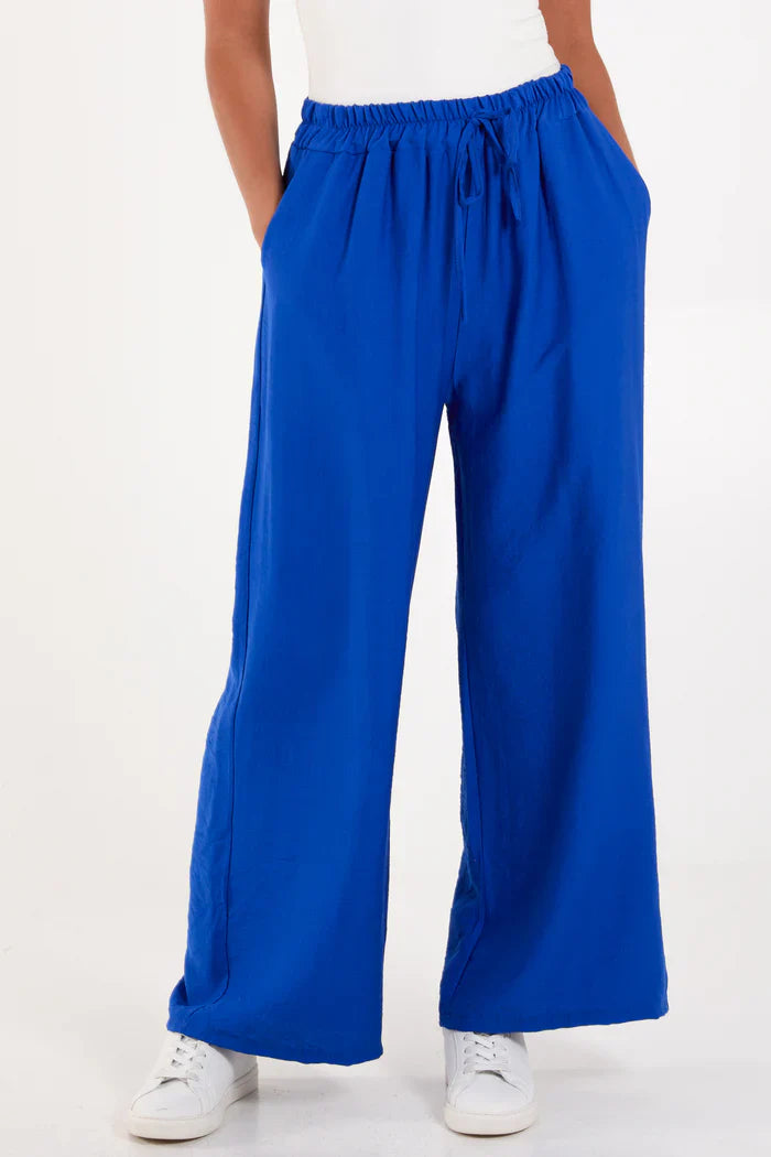 Blue wide leg crepe trousers made from 100% viscose.