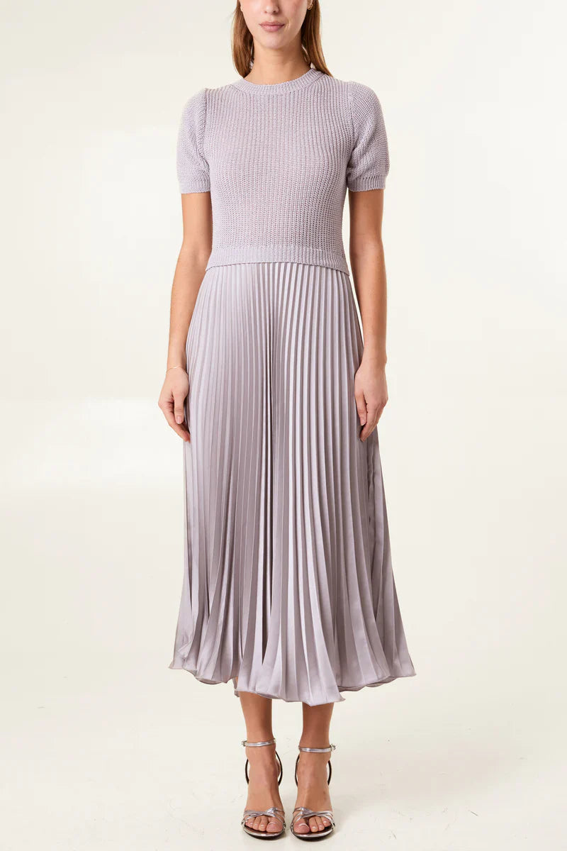Short sleeve pleated jumper dress with satin pleated skirt.