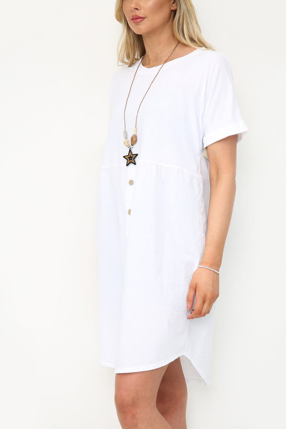 White button-up dress with necklace, made from 100% cotton.