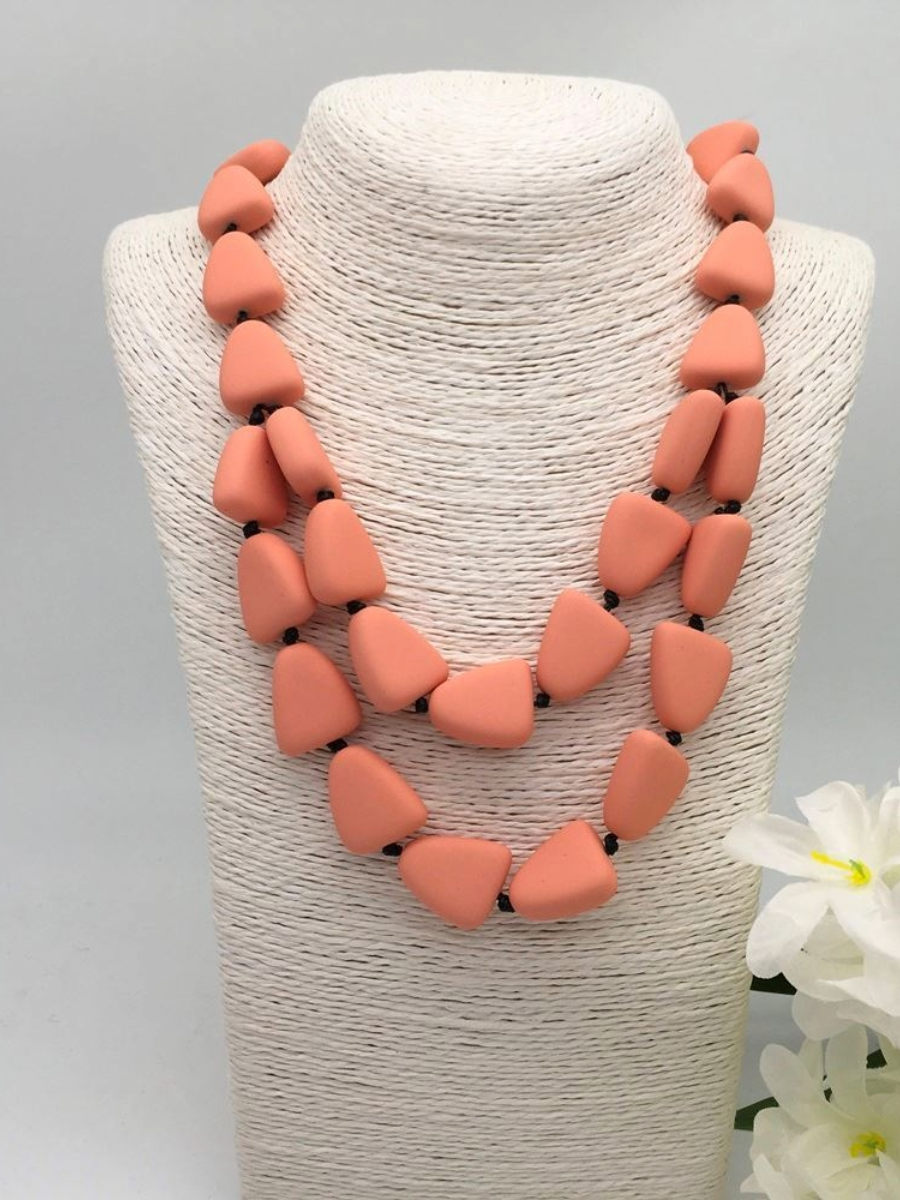 Short Pebbles Necklace with adjustable gold metal fastening and faux double strand effect.