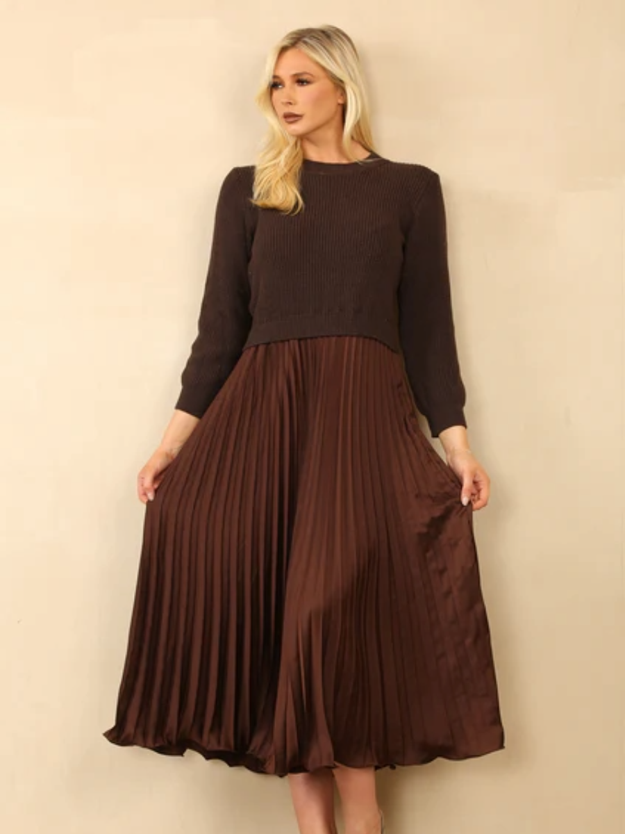 Pleated jumper dress with knitted top and satin pleated skirt.