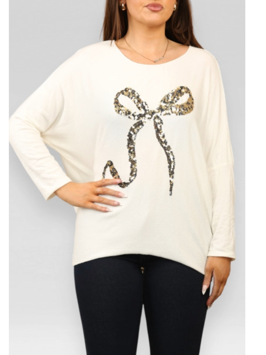 Sequin Bow Top - Long Sleeve Soft Touch Material shown on model.