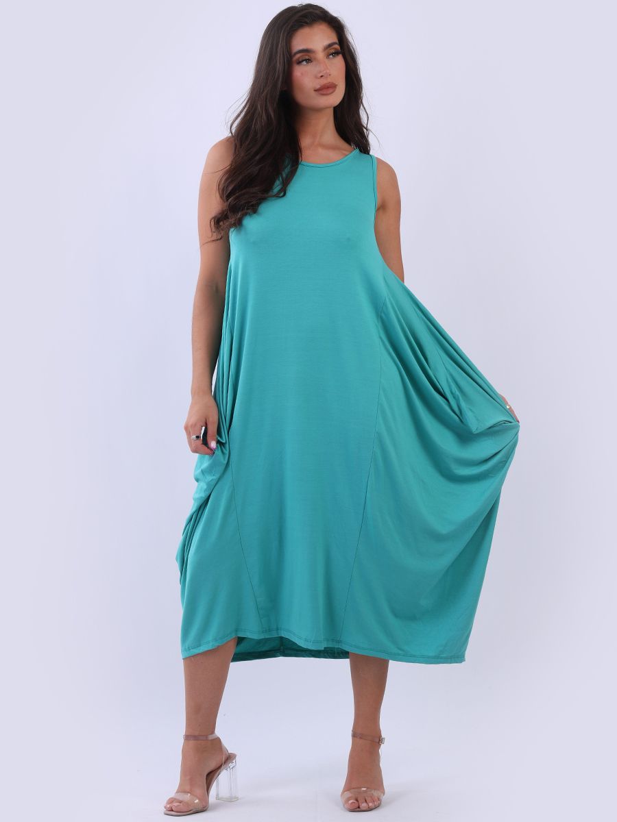 Sleeveless turquoise parachute dress with scoop neck and maxi style.