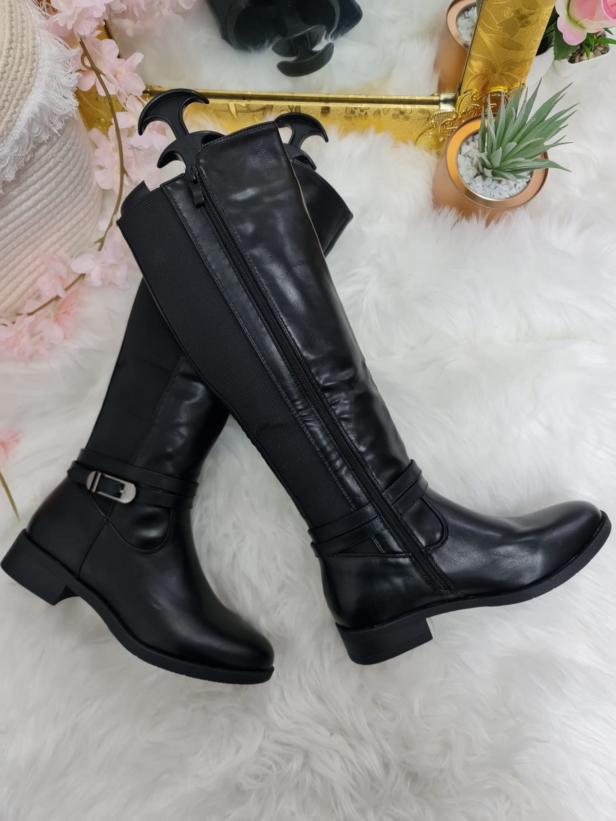 Knee high wide fit boots with buckle and zip detail in black leather.